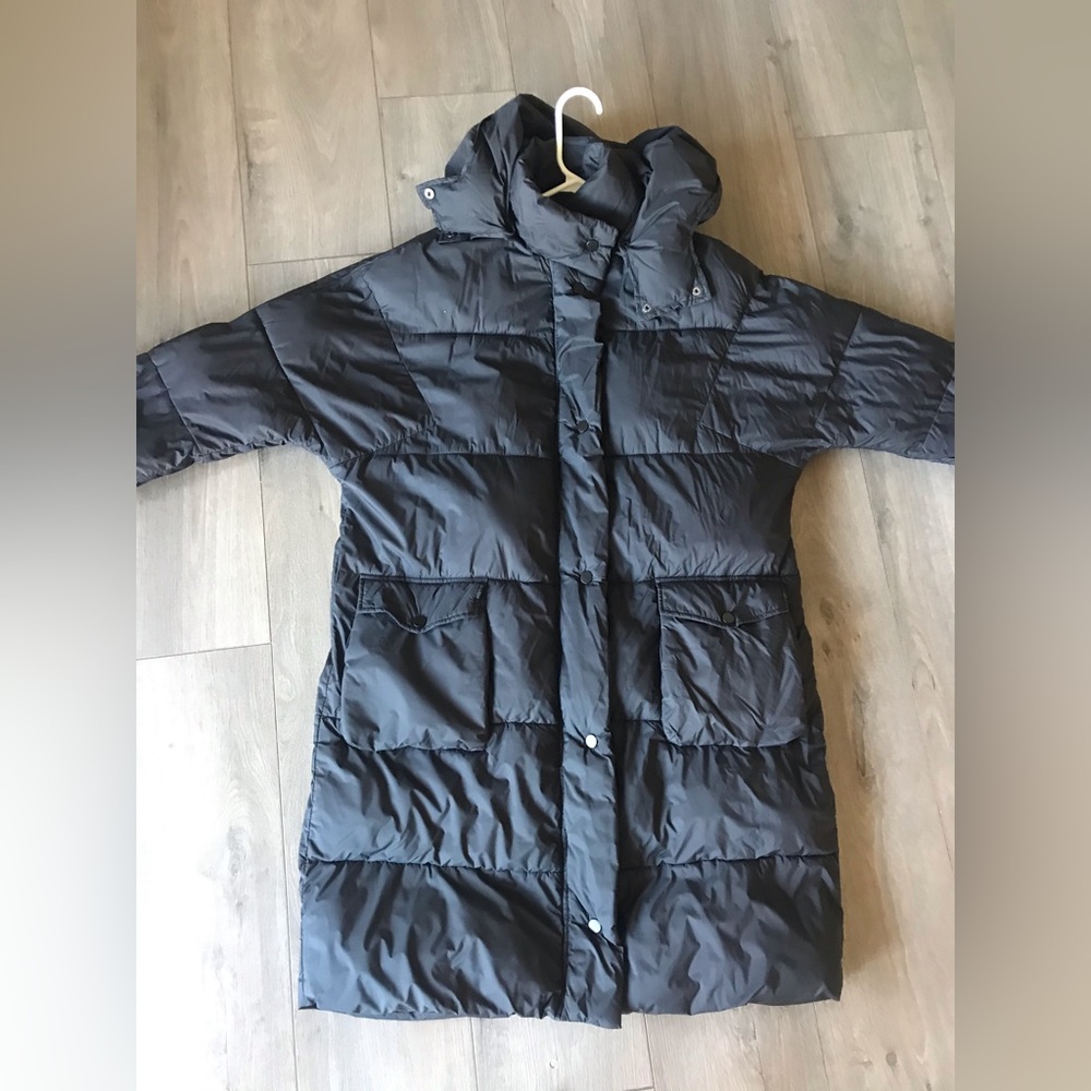 Urban Outfitters black knee-length puffer jacket.